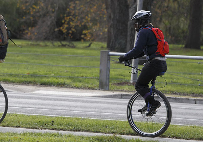 It is much harder to ride a unicycle without handlebars